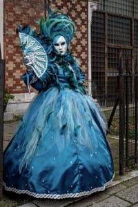 The parade of people in costume at the 2026 Venice Carnival in front of the Church of San Zaccaria.