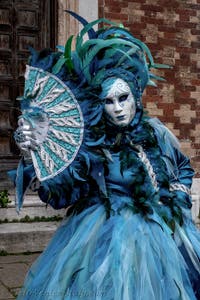 The parade of people in costume at the 2026 Venice Carnival in front of the Church of San Zaccaria.