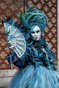 The parade of people in costume at the 2026 Venice Carnival in front of the Church of San Zaccaria.