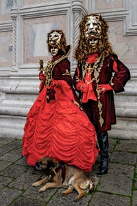 The parade of people in costume at the 2026 Venice Carnival in front of the Church of San Zaccaria.