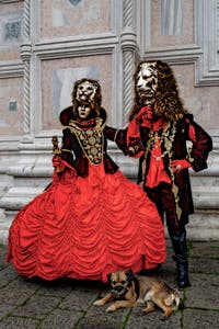 The parade of people in costume at the 2026 Venice Carnival in front of the Church of San Zaccaria.