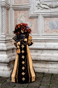 The parade of people in costume at the 2026 Venice Carnival in front of the Church of San Zaccaria.