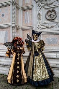 The parade of people in costume at the 2026 Venice Carnival in front of the Church of San Zaccaria.