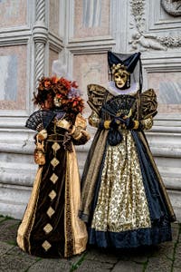 The parade of people in costume at the 2026 Venice Carnival in front of the Church of San Zaccaria.