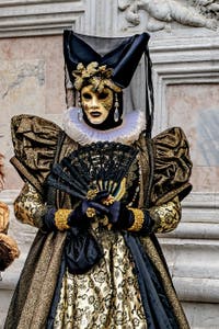 The parade of people in costume at the 2026 Venice Carnival in front of the Church of San Zaccaria.