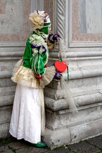 The parade of people in costume at the 2026 Venice Carnival in front of the Church of San Zaccaria.