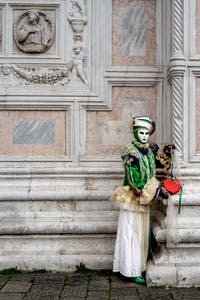 The parade of people in costume at the 2026 Venice Carnival in front of the Church of San Zaccaria.
