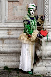 The parade of people in costume at the 2026 Venice Carnival in front of the Church of San Zaccaria.