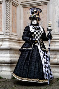 The parade of people in costume at the 2026 Venice Carnival in front of the Church of San Zaccaria.