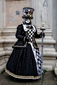 The parade of people in costume at the 2026 Venice Carnival in front of the Church of San Zaccaria.