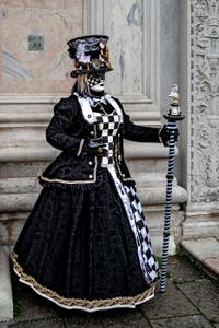 The parade of people in costume at the 2026 Venice Carnival in front of the Church of San Zaccaria.