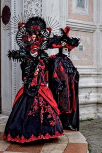 The parade of people in costume at the 2026 Venice Carnival in front of the Church of San Zaccaria.