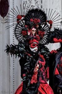 The parade of people in costume at the 2026 Venice Carnival in front of the Church of San Zaccaria.