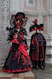 The parade of people in costume at the 2026 Venice Carnival in front of the Church of San Zaccaria.