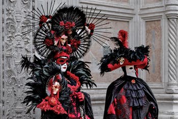 The parade of people in costume at the 2026 Venice Carnival in front of the Church of San Zaccaria.