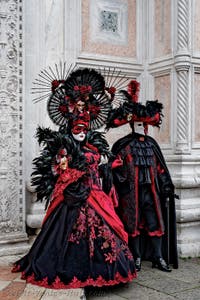 The parade of people in costume at the 2026 Venice Carnival in front of the Church of San Zaccaria.