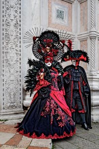 The parade of people in costume at the 2026 Venice Carnival in front of the Church of San Zaccaria.
