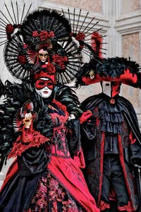 The parade of people in costume at the 2026 Venice Carnival in front of the Church of San Zaccaria.