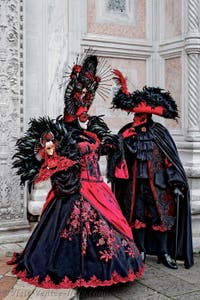 The parade of people in costume at the 2026 Venice Carnival in front of the Church of San Zaccaria.