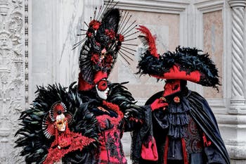 The parade of people in costume at the 2026 Venice Carnival in front of the Church of San Zaccaria.