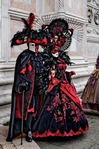 The parade of people in costume at the 2026 Venice Carnival in front of the Church of San Zaccaria.