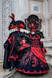 The parade of people in costume at the 2026 Venice Carnival in front of the Church of San Zaccaria.
