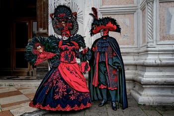 The parade of people in costume at the 2026 Venice Carnival in front of the Church of San Zaccaria.