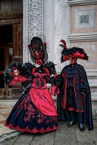 The parade of people in costume at the 2026 Venice Carnival in front of the Church of San Zaccaria.