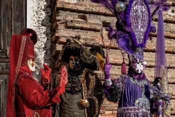 Venice carnival costumed figures