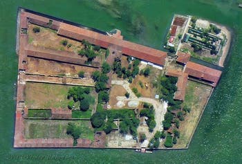 The island of Lazzaretto Vecchio, where plague victims were cured, opposite the island of Lido in Venice