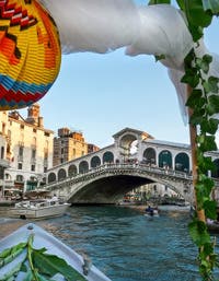 The Festa del Redentore, decorated boat in front of the Rialto bridge in Venice