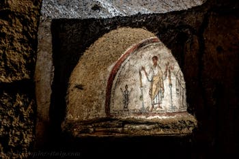 Fresco depicting San Gennaro with Nicaziola and Cominia, in the Catacombs of San Gennaro in Naples, Italy