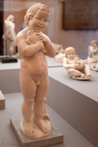 Child stroking a dove, Vesuvius region, Archaeological Museum of Naples, Italy