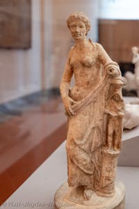 A half-naked Venus leaning against a pillar with an idol, House of Epidius Rufus, Pompeii, Archaeological Museum of Naples, Italy