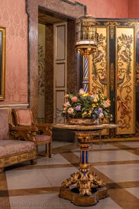 Pedestal table with birdcage, bouquet of flowers and views of Saint Petersburg, the Flemish Room at the Royal Palace of Naples