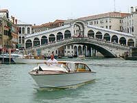 Motoscafo in front of the bridge of Rialto Venice Italy